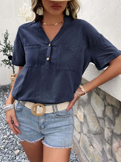 Blusa con botones y cuello con muescas y mangas con puños