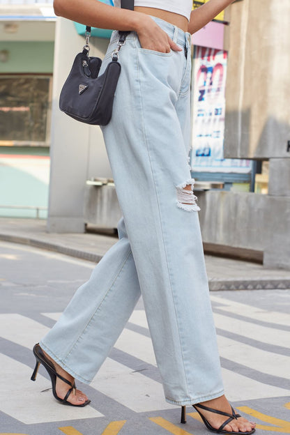 Jeans rectos desgastados con bolsillos