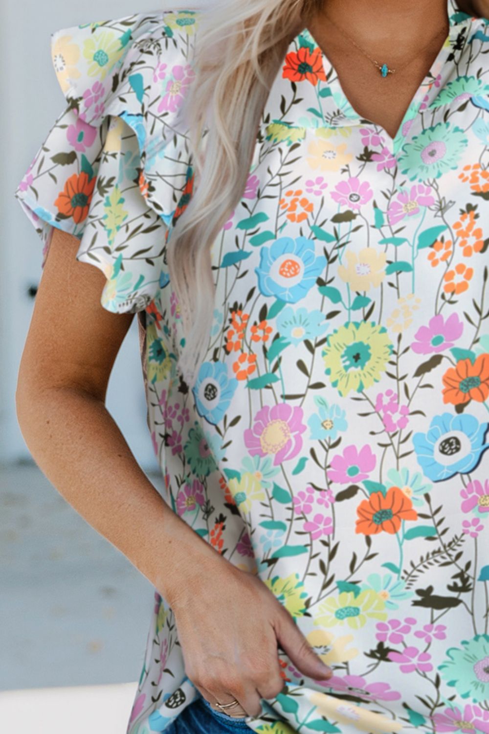 Blusa floral con mangas abullonadas en capas