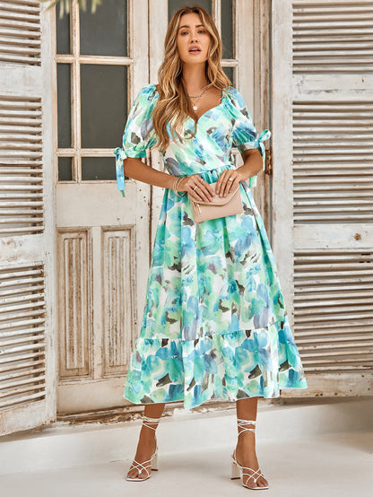 Vestido con cuello de sobrepelliz y puños con lazo floral