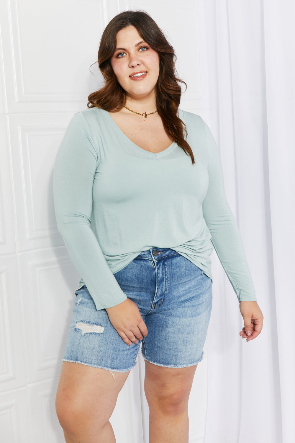 Zenana Full Size V-Neck Curved Hem Top in Light Green