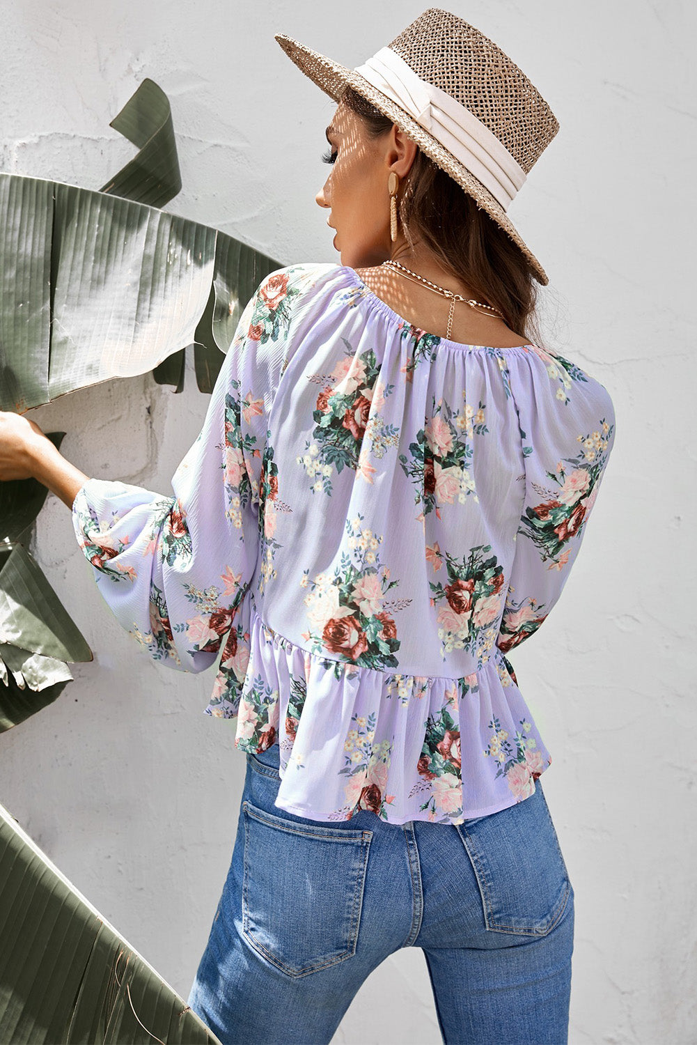 Blusa con péplum retorcido floral