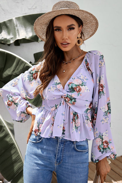 Blusa con péplum retorcido floral