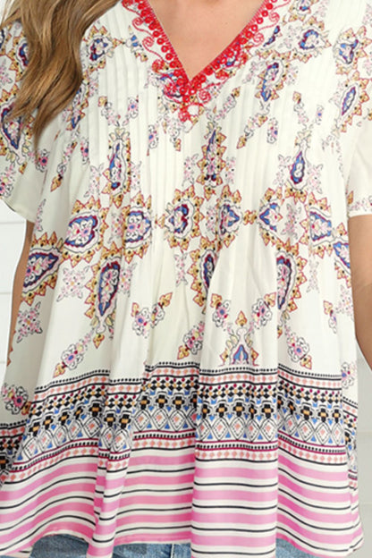 Blusa bohemia con cuello en V y manga ondulada