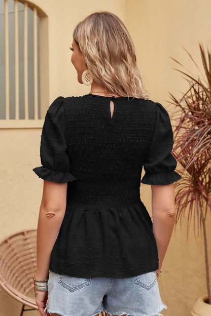 Blusa con peplum fruncido de lunares suizos